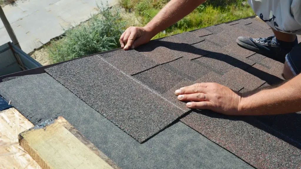 Patched roof hole with roofing cement.