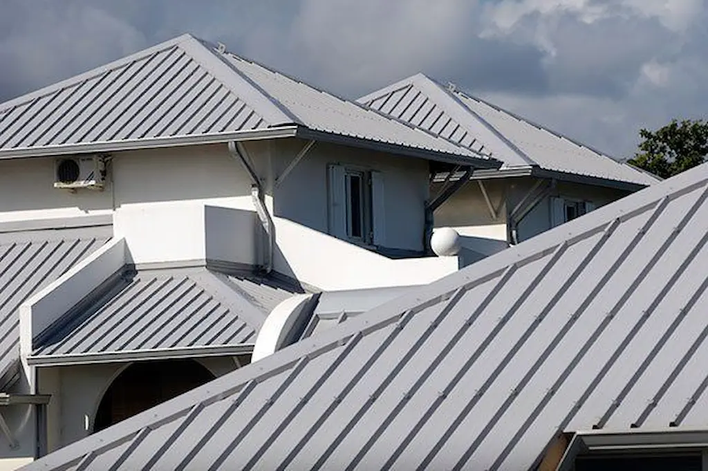 Wind-resistant metal roof shingles for storm protection